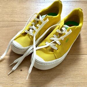 Bright yellow women’s Cariuma sneakers
